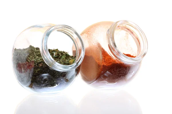 Jars with spices paprika and lovage isolated — Stock Photo, Image