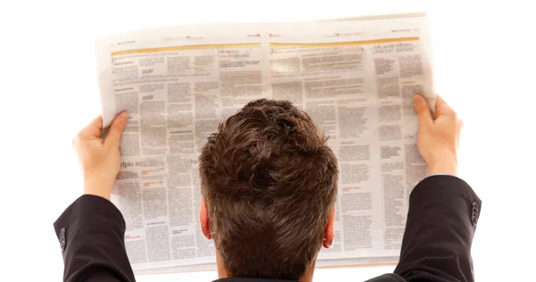 Empresário lendo um jornal isolado — Fotografia de Stock