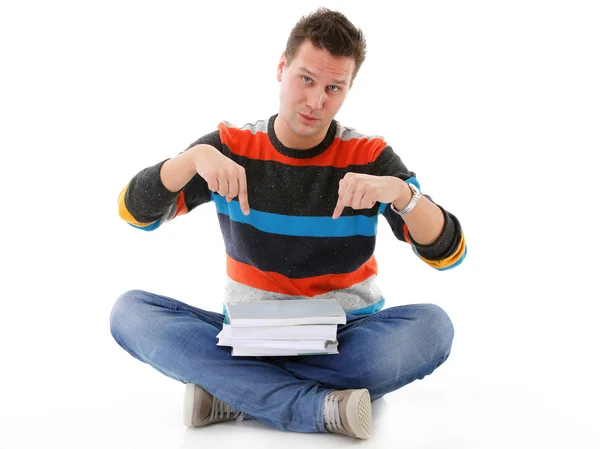 Male student offering books isolated — Stock Photo, Image