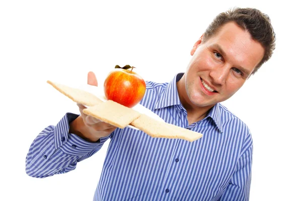 Healthy lifestyle man eating crispbread and apple — Stock Photo, Image