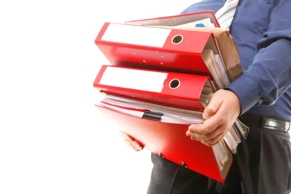 Trabajador de oficina que lleva una pila de archivos — Foto de Stock