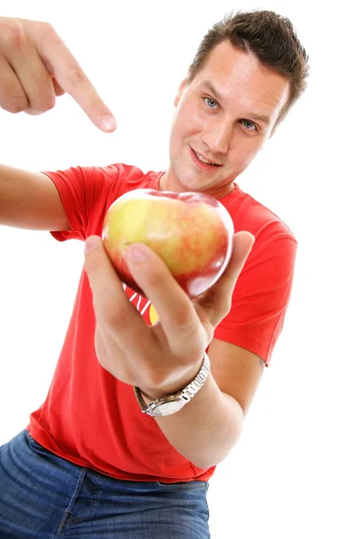 Happy man in red shirt pointing the apple — Stock Photo, Image