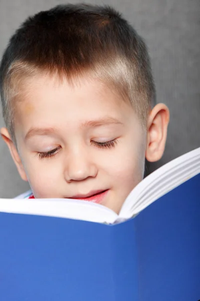 Closeup child boy with a book — Stock Photo, Image