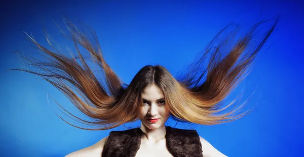 Fashion model with hair blowing in the wind — Stock Photo, Image