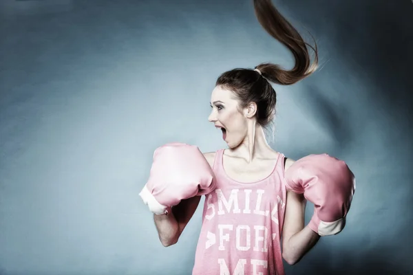 Female boxer model with big fun pink gloves — Stock Photo, Image