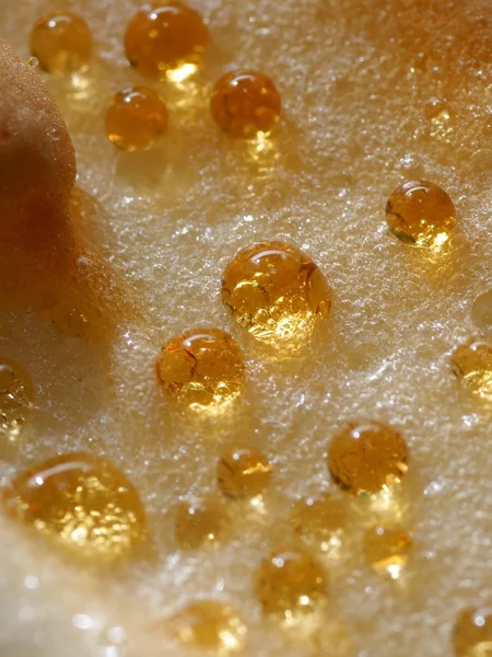 Gold macro drops on cheesecake — Stock Photo, Image