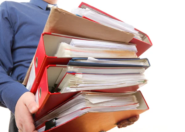 Male office worker carrying a stack of files — Stock Photo, Image