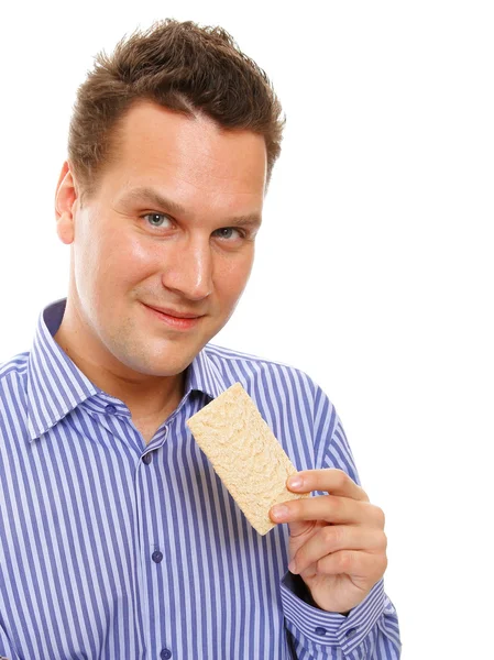 Estilo de vida saludable hombre comiendo pan crujiente aislado — Foto de Stock