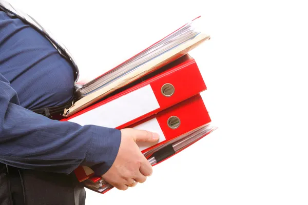 Male office worker carrying a stack of files — Stock Photo, Image