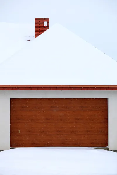 Car garage door surrounded by snow — Stock Photo, Image