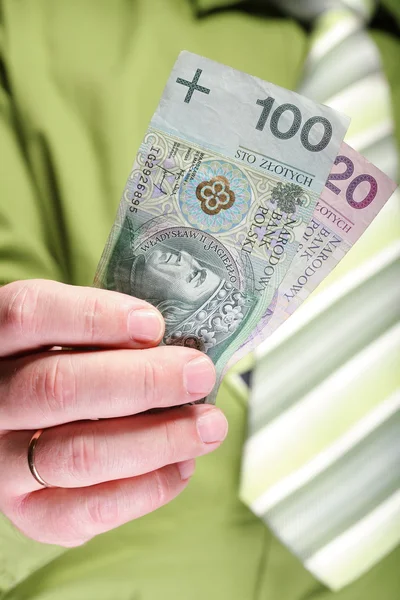 Empresario sosteniendo dinero 100 pulido zloty —  Fotos de Stock