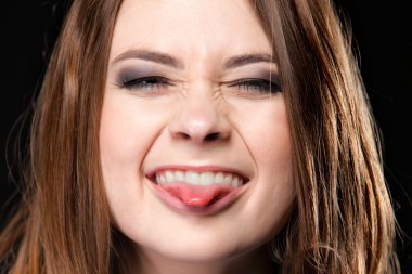 Grimacing. Young Woman Making Silly Face. clipart