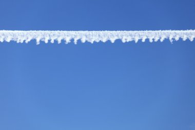 Airplane tracks in the blue sky clipart
