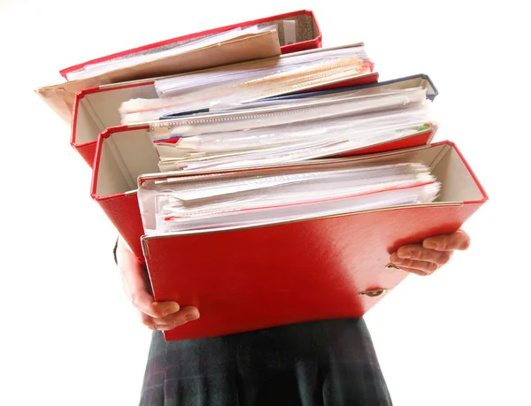 Female office worker carrying a stack of files — Stock Photo, Image