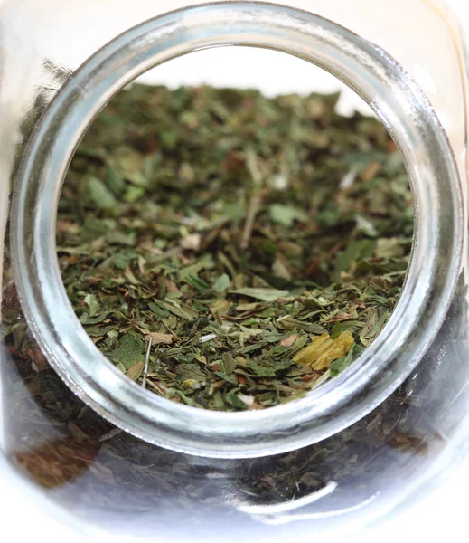 Close up jar with lovage spice isolated — Stock Photo, Image
