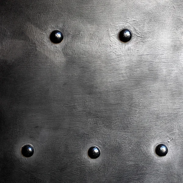 Black metal plate or armour texture with rivets — Stock Photo, Image