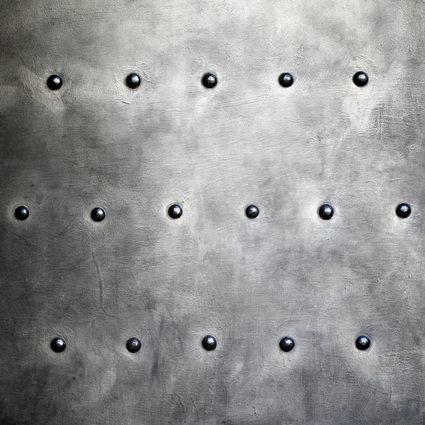 Black metal plate or armour texture with rivets — Stock Photo, Image