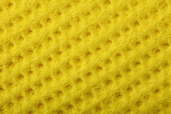 Busa spons kuning sebagai tekstur latar belakang — Stok Foto