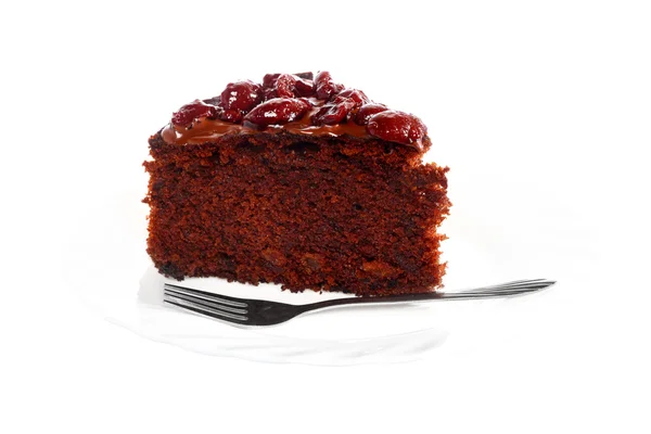 Piece of chocolate cake with icing and cherry — Stock Photo, Image