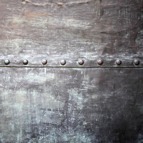 Black metal plate or armour texture with rivets — Stock Photo, Image