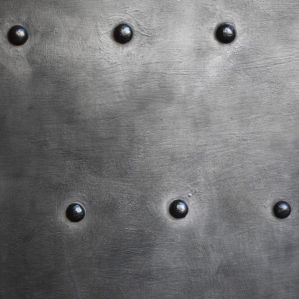 Black metal plate or armour texture with rivets — Stock Photo, Image