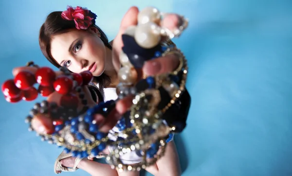 Summer girl plenty of jewellery beads in hands — Stock Photo, Image
