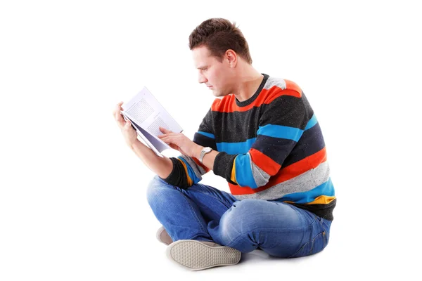 Male student reading a book isolated — Stock Photo, Image