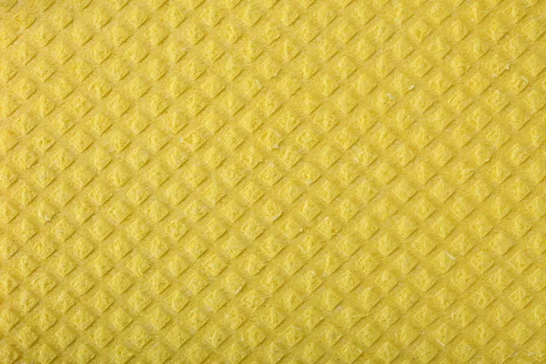 Yellow sponge foam as background texture — Stock Photo, Image