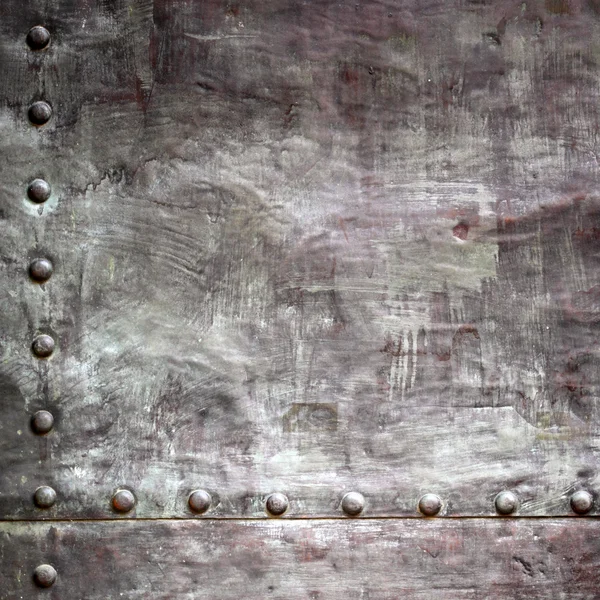 Black metal plate or armour texture with rivets — Stock Photo, Image