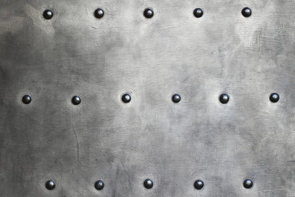 Black metal plate or armour texture with rivets — Stock Photo, Image