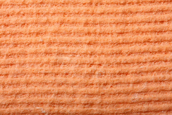 Orange sponge foam as background texture — Stock Photo, Image