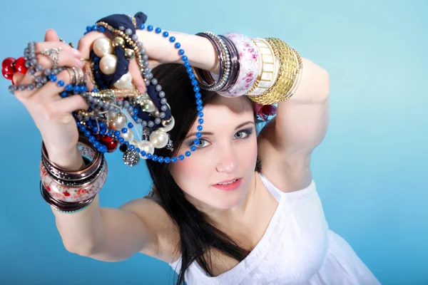 Summer girl plenty of jewellery beads in hands — Stock Photo, Image