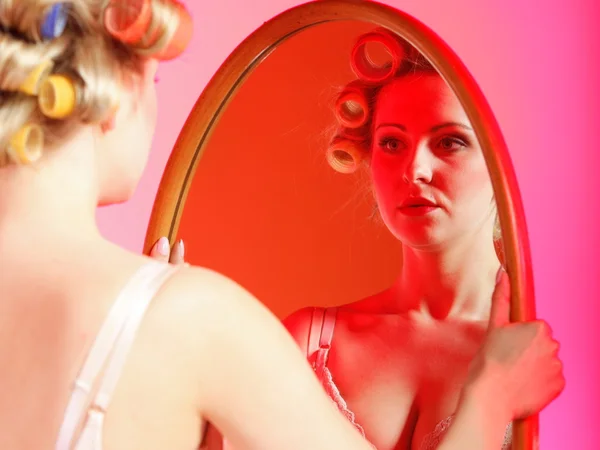 Sexy girl in underwear curlers preparing to party — Stock Photo, Image