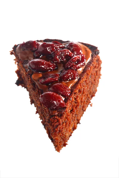 Piece of chocolate cake with icing and cherry — Stock Photo, Image