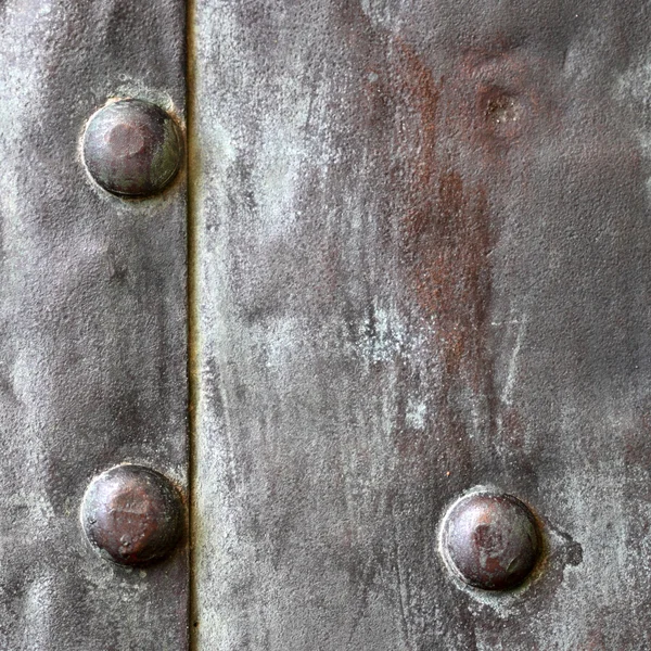 Black metal plate or armour texture with rivets — Stock Photo, Image