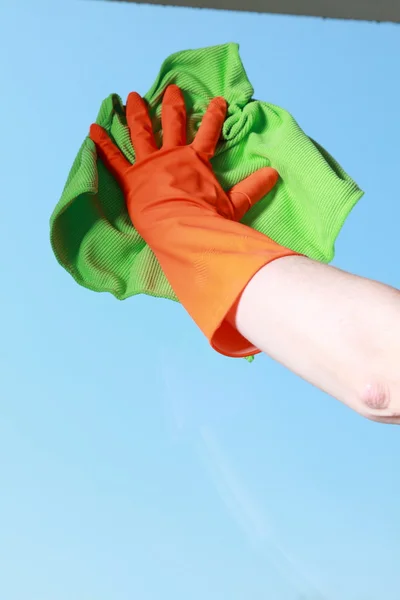 Gloved hand cleaning window with rag — Stock Photo, Image