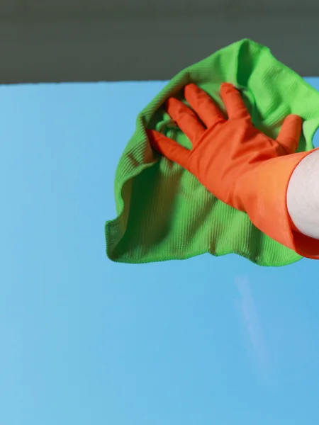 Gloved hand cleaning window with rag — Stock Photo, Image