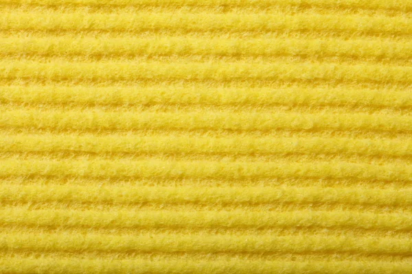 Geel sponsschuim als achtergrond textuur — Stockfoto