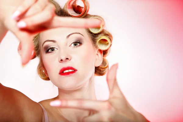 Sexy woman in underwear curlers making frame — Stock Photo, Image