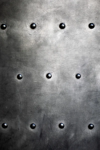 Black metal plate or armour texture with rivets — Stock Photo, Image