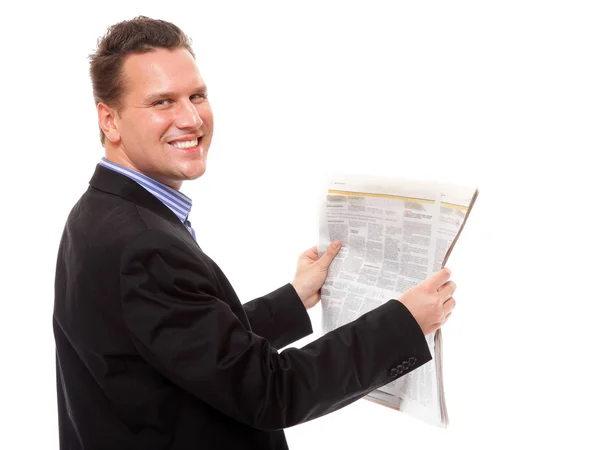 Empresario leyendo un periódico aislado — Foto de Stock