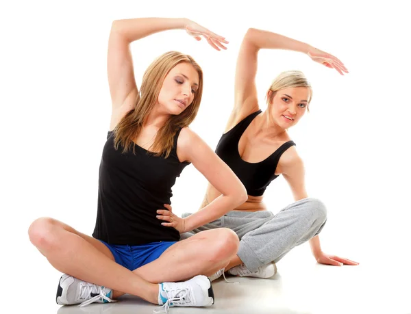 Två kvinnor gör fitness motion isolerade — Stockfoto
