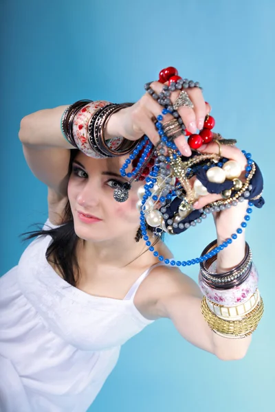 Summer girl plenty of jewellery beads in hands — Stock Photo, Image