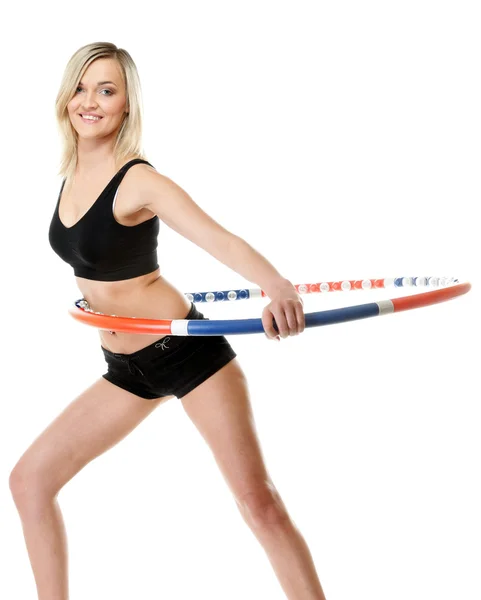 Junge Fitness-Frau mit Hula-Hoop-Reifen isoliert — Stockfoto