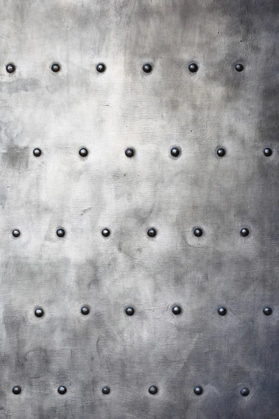 Black metal plate or armour texture with rivets — Stock Photo, Image