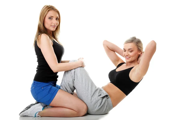 Two women doing fitness exercise isolated — Stock Photo, Image