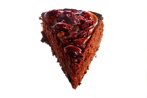 Piece of chocolate cake with icing and cherry — Stock Photo, Image