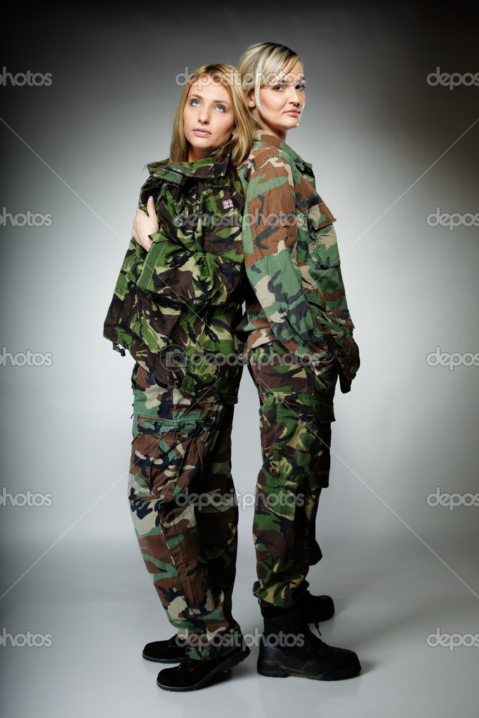 Two women in military clothes, army girls Stock Photo by ©Voyagerix