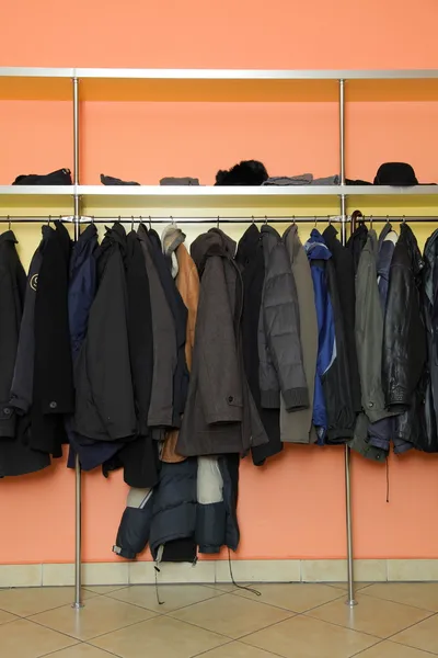 Many clothes in cloakroom — Stock Photo, Image