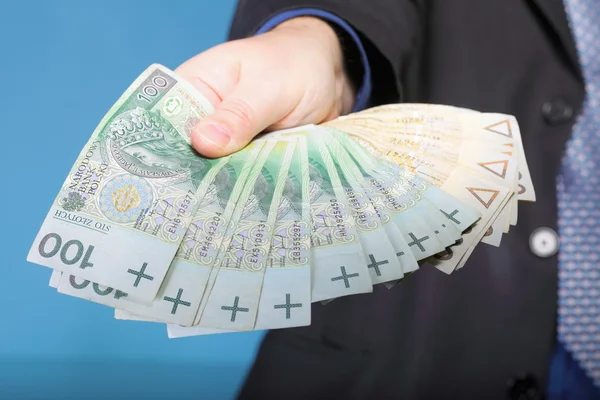 Geschäftsmann mit polnischer Banknote — Stockfoto